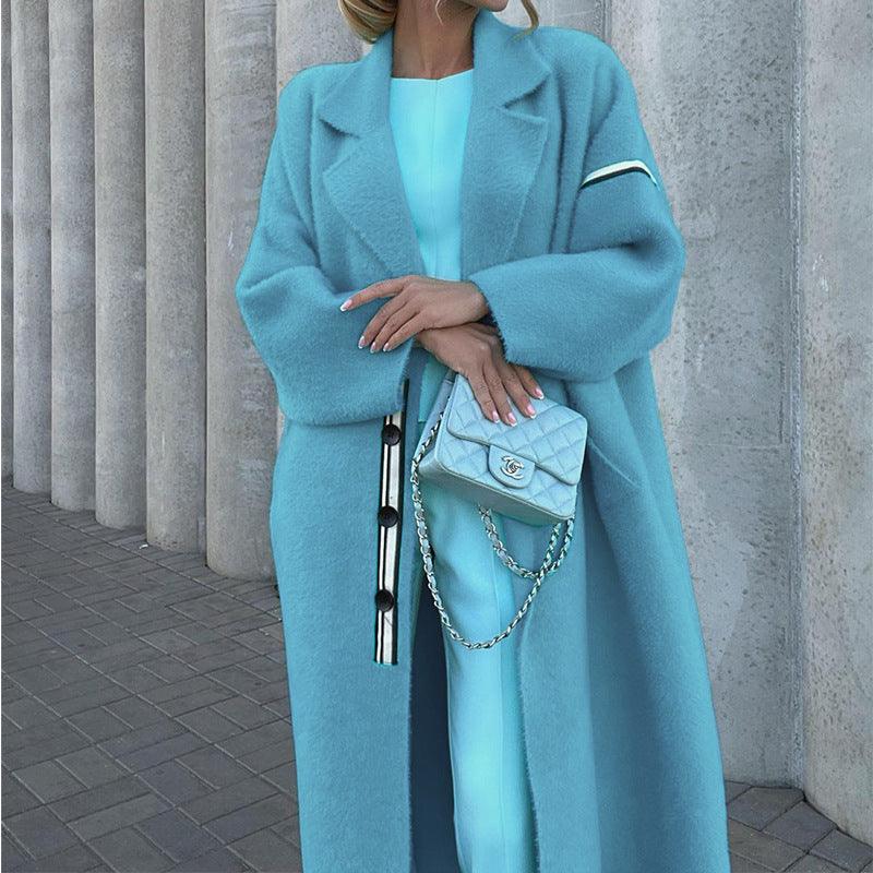 Women's light blue loose thin wool coat with buttoned front and notched lapels