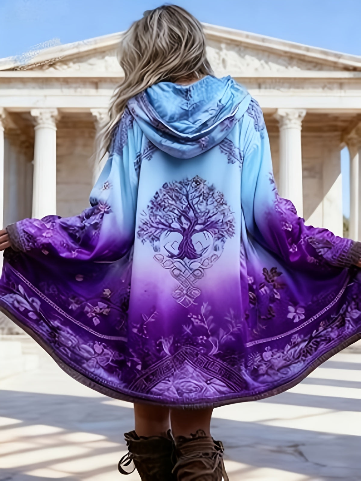 Long hooded retro coat in purple with ornate tree-and-vine print, flowing cape sleeves