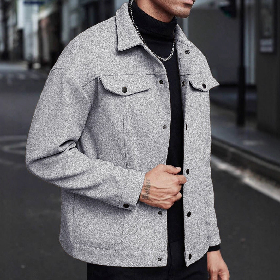 Men’s gray wool jacket with button front, pointed collar, and chest flap pockets