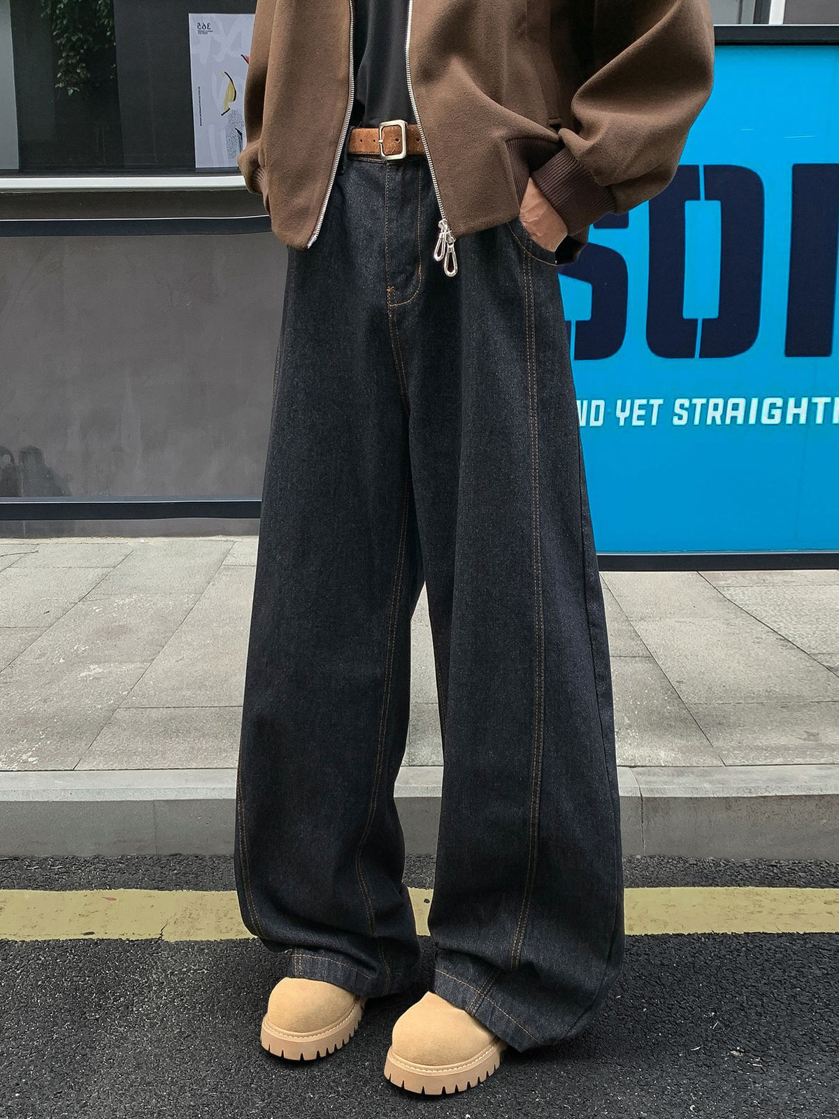Men's dark wash bootcut jeans with contrast seams and wide flared legs
