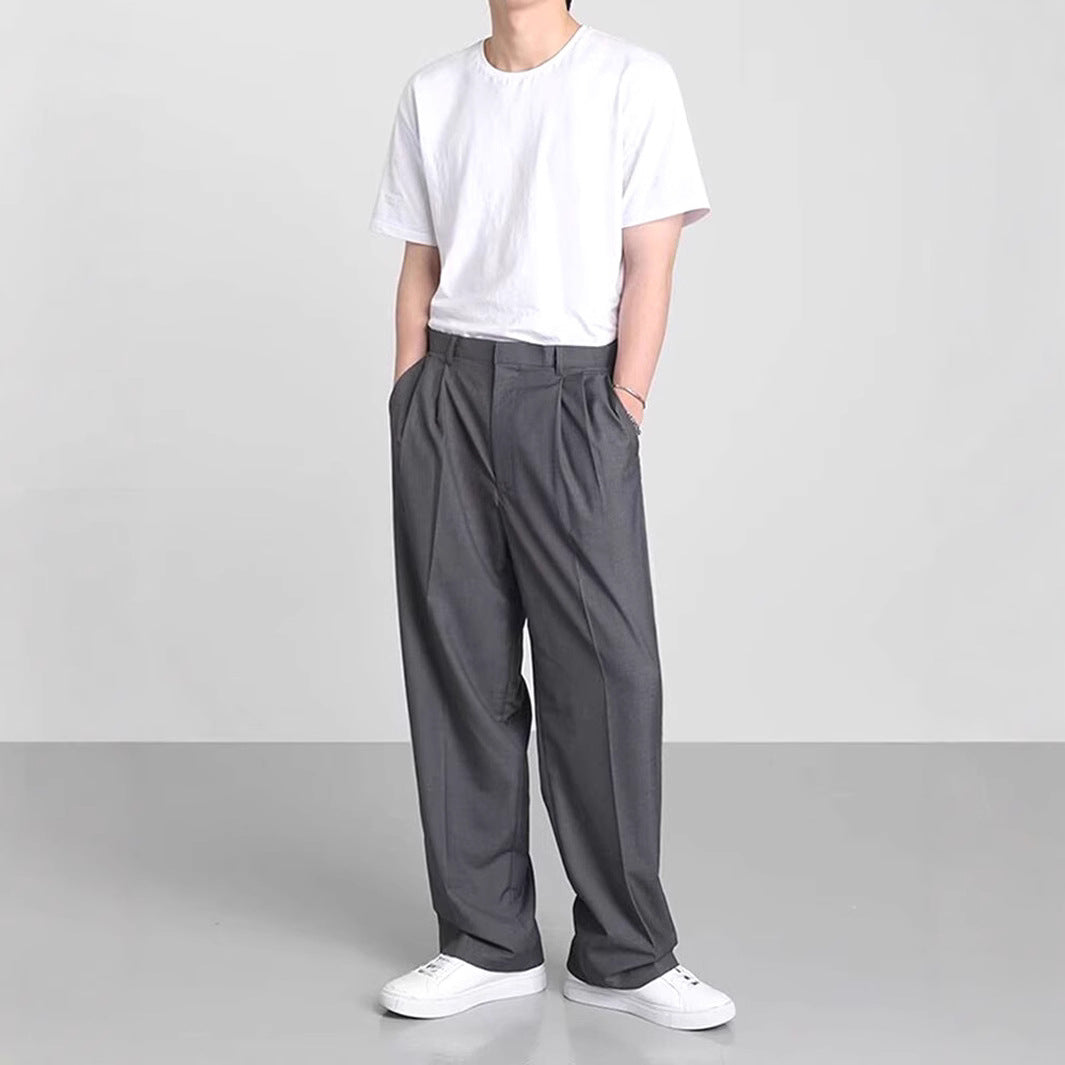 Dark gray wide-leg suit trousers with pleated front and relaxed straight legs