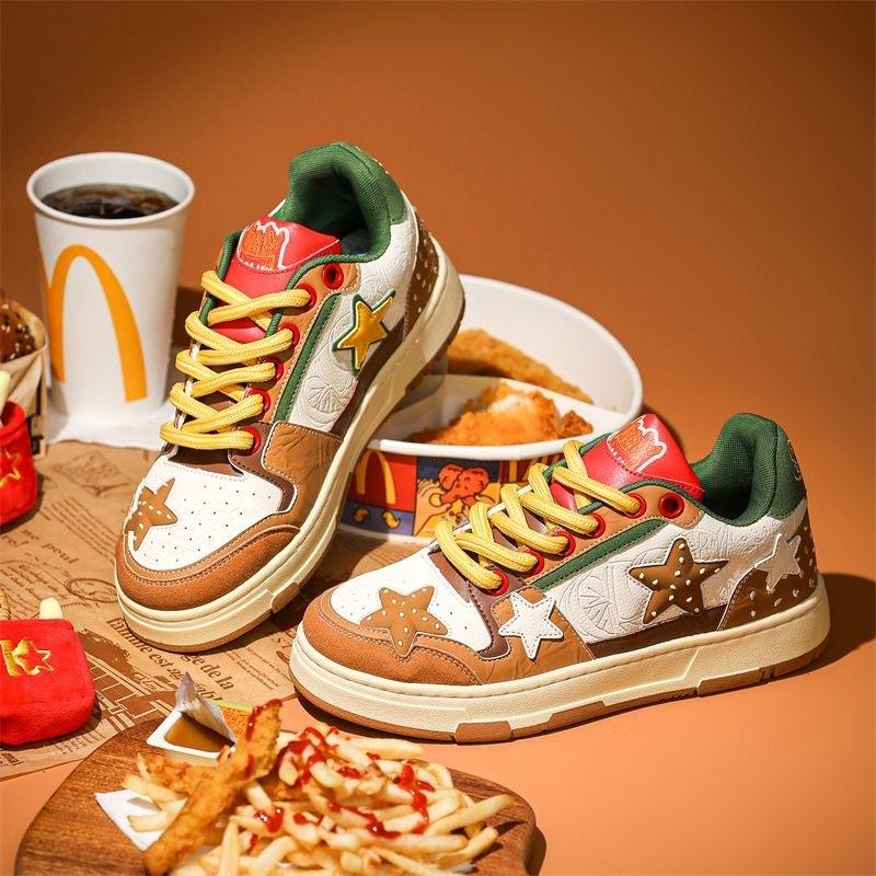 Brown, white & green lace-up platform sneakers with red accent cuffs and star patches