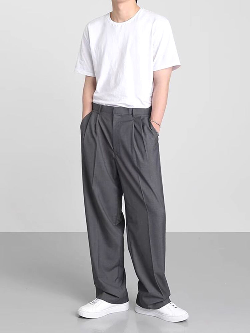 Dark gray wide-leg suit trousers with pleated front and relaxed straight-leg cut
