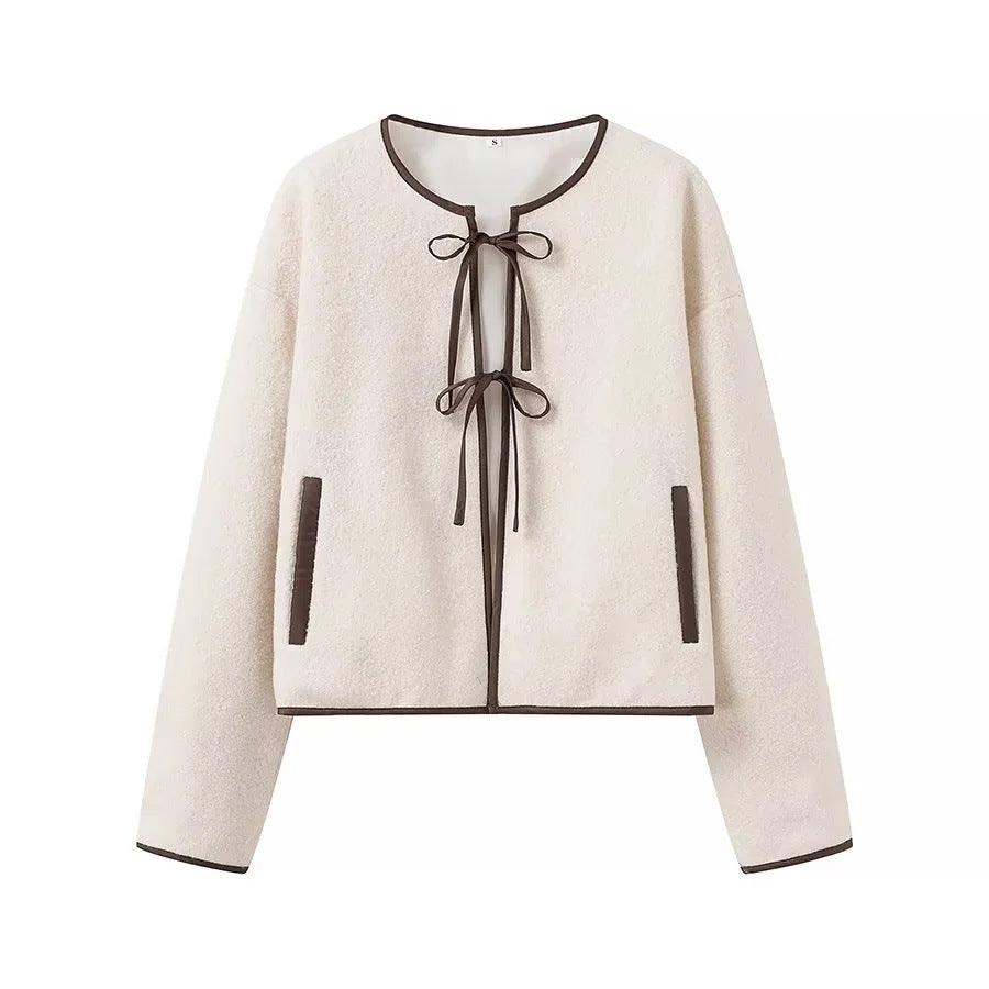 Off-white round-neck tie-front top with ribbon bow neckline and long sleeves