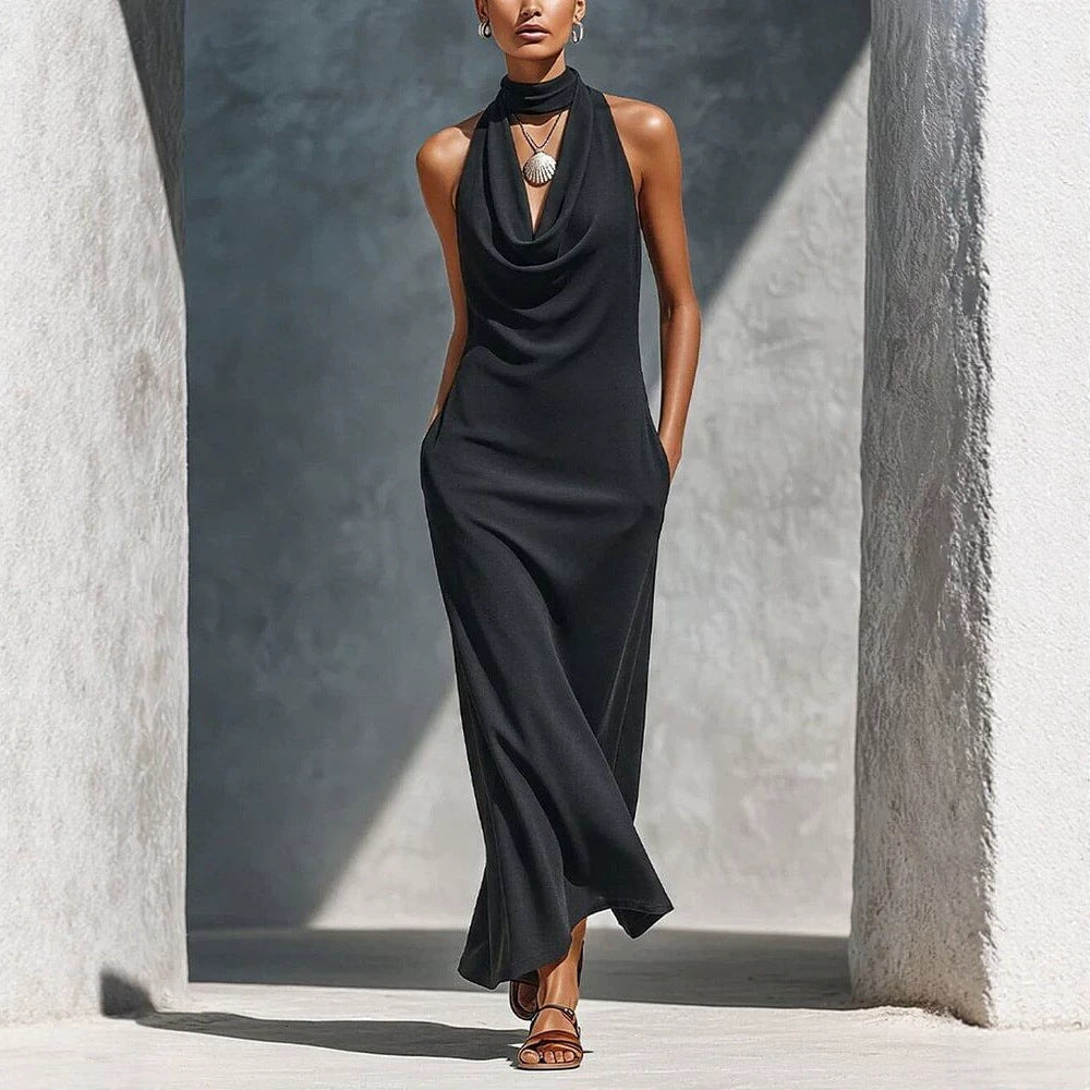 Black halter dress with draped neckline, sleeveless fit-and-flare to maxi length