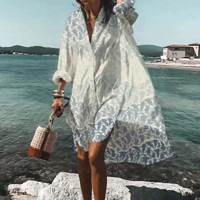 Light blue printed V-neck half-sleeve dress with loose silhouette, above-knee length