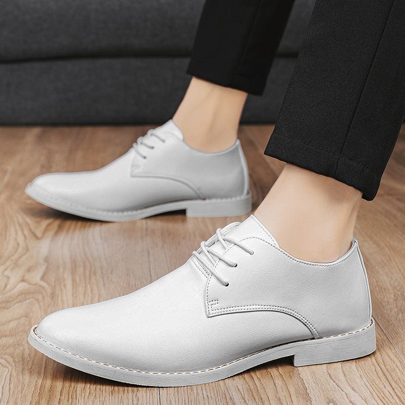 Men's white leather lace-up shoes with rounded toe and stitched panels
