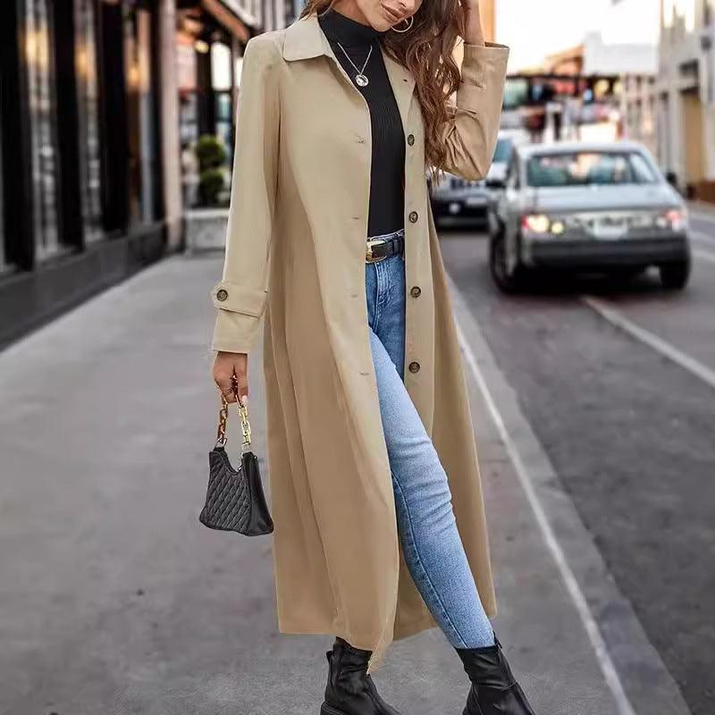 Women’s long trench coat in apricot, button-front with notched lapels, long sleeves.