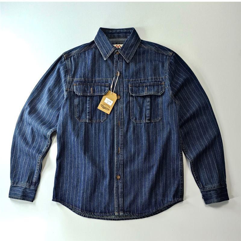 Washed blue denim shirt for men with button front, flap chest pockets, and tag