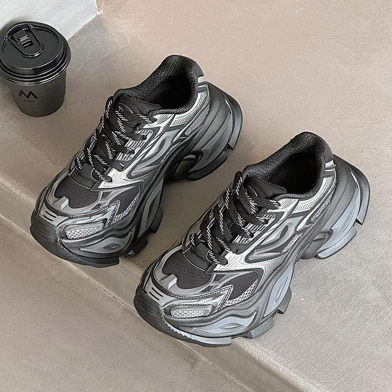 Black and grey lace-up chunky dad shoes with breathable mesh and oversized tread