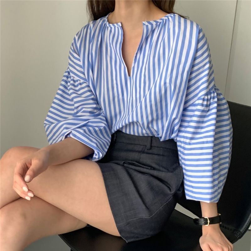 Blue striped lantern-sleeve top with V-notch neckline, loose relaxed fit