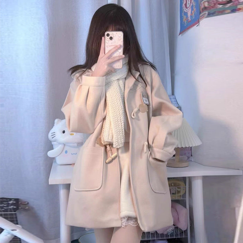 Light apricot wool school coat with toggle horn-style buttons and two front pockets