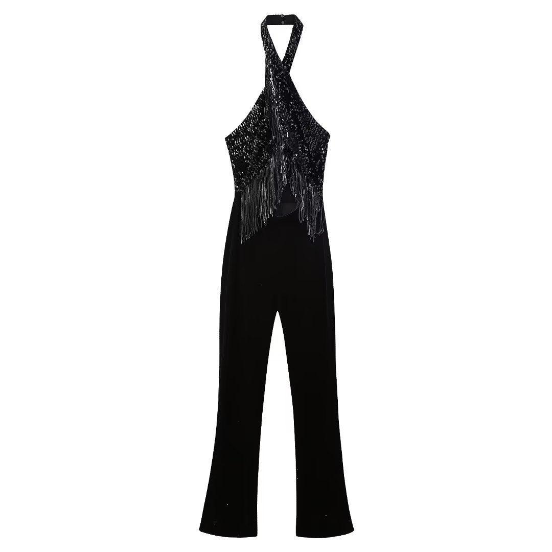 Black halter jumpsuit on white background with sequin top and tassel fringe