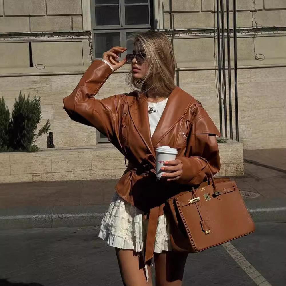 Women’s brown imitation leather jacket coat with V-neck lapels and tie belt, side pockets