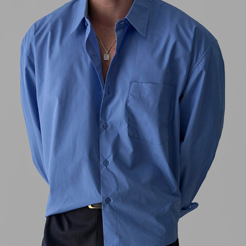 Men's blue long-sleeve button-up shirt with single chest pocket