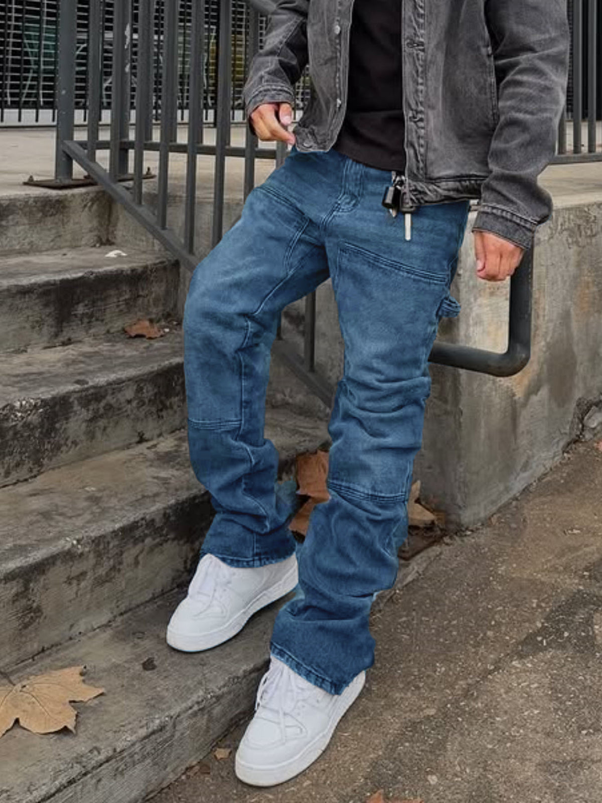 Blue ripped hip cargo stretch bootcut trousers with flap pockets and cuffed hems