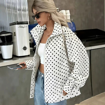 White short coat with navy polka dots, pointed collar, long sleeves, open front