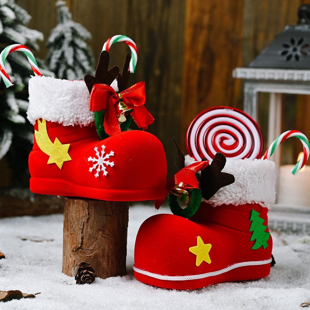 Red Santa boot decoration with white cuff, yellow star and snowflake, ribbon bow