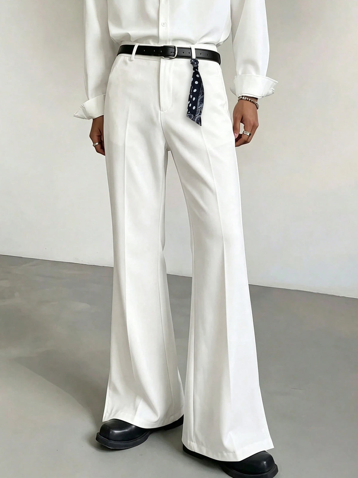 Men's white high-waist slightly flared casual pants with belt loops and front creases
