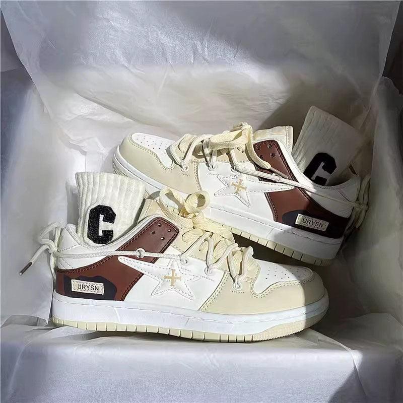 White and beige lace-up sneakers with brown side panel and cushioned sole