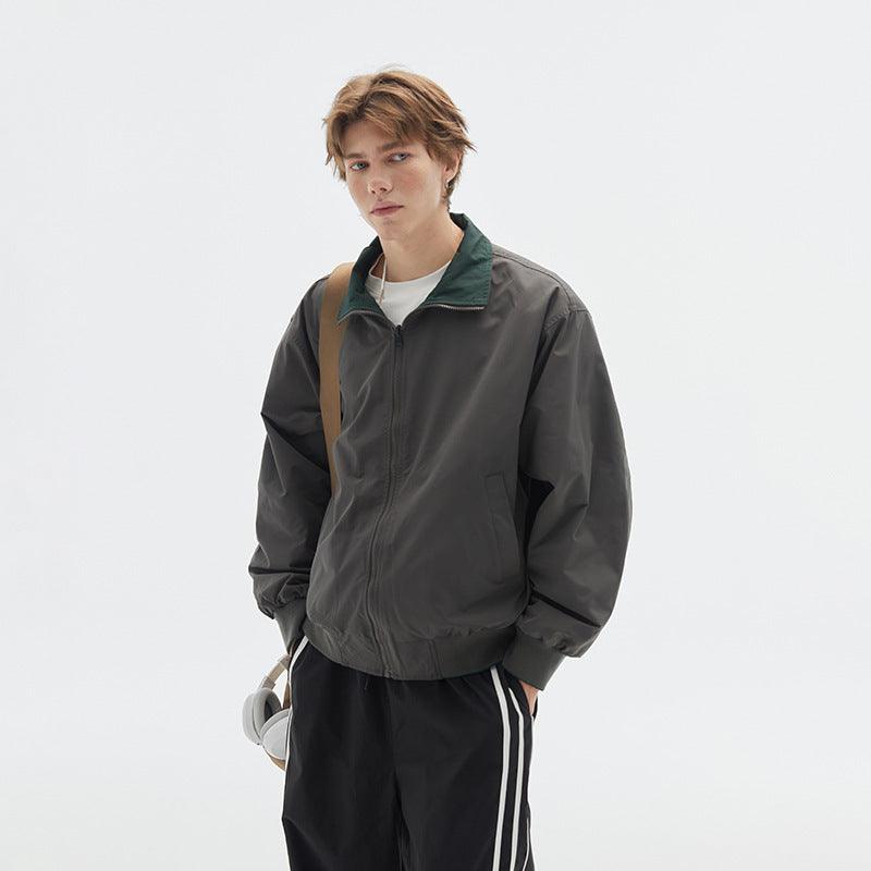 Green stand-collar jacket with zip front, ribbed cuffs and hem