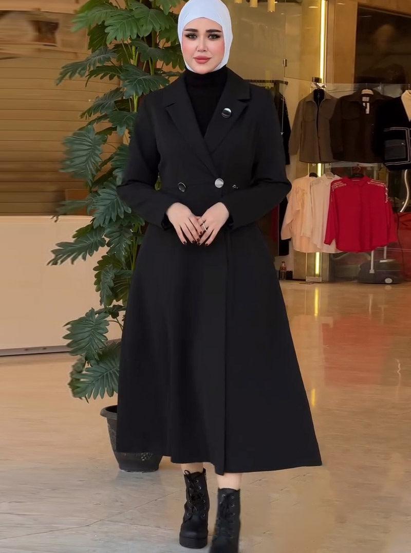 Black mid-length double-breasted trench-style coat with notched lapels and structured front