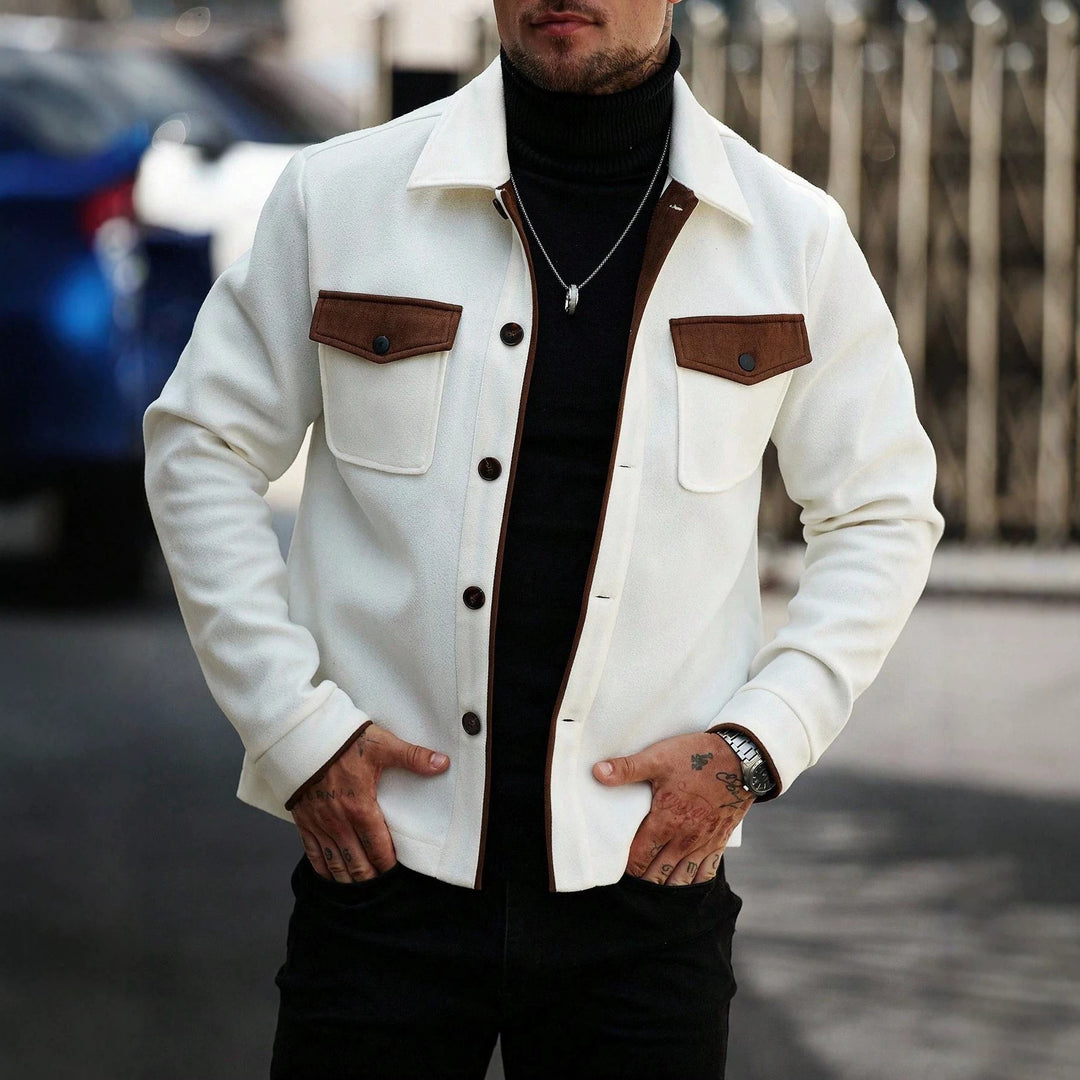 White wool workwear jacket with brown patch pockets, button front, and spread collar.