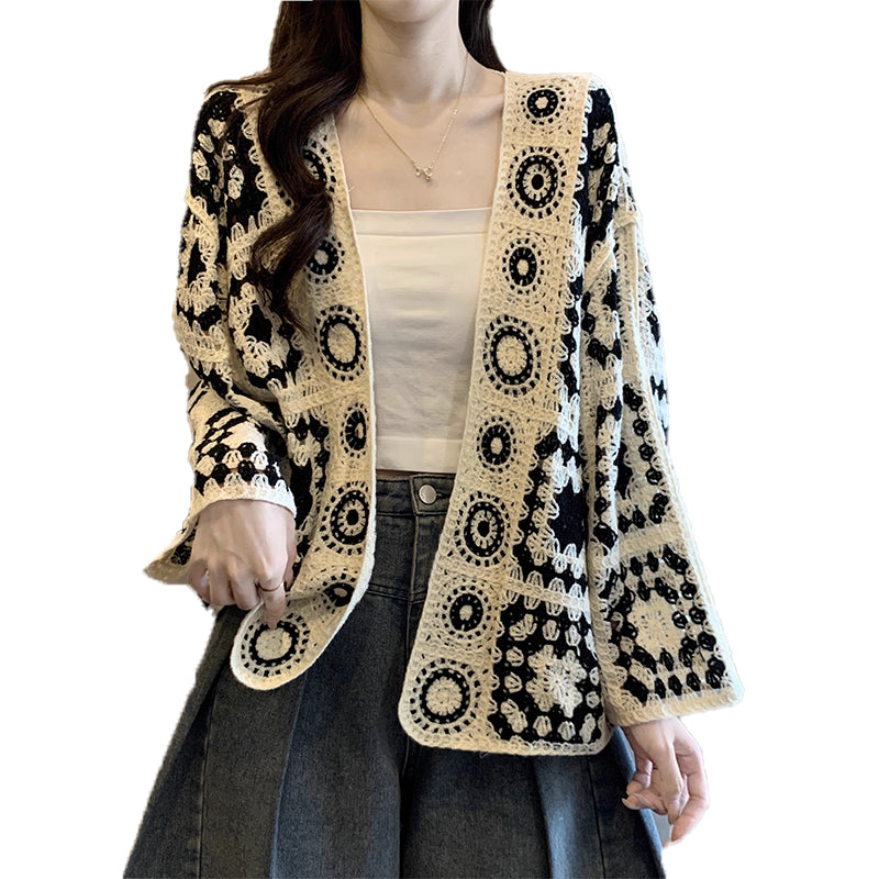 Black hollow-out crocheted long-sleeve cardigan with circular lace trim, open front