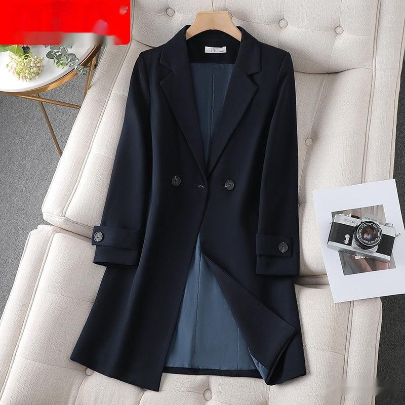 Black mid-length trench coat on hanger with double-breasted button placket