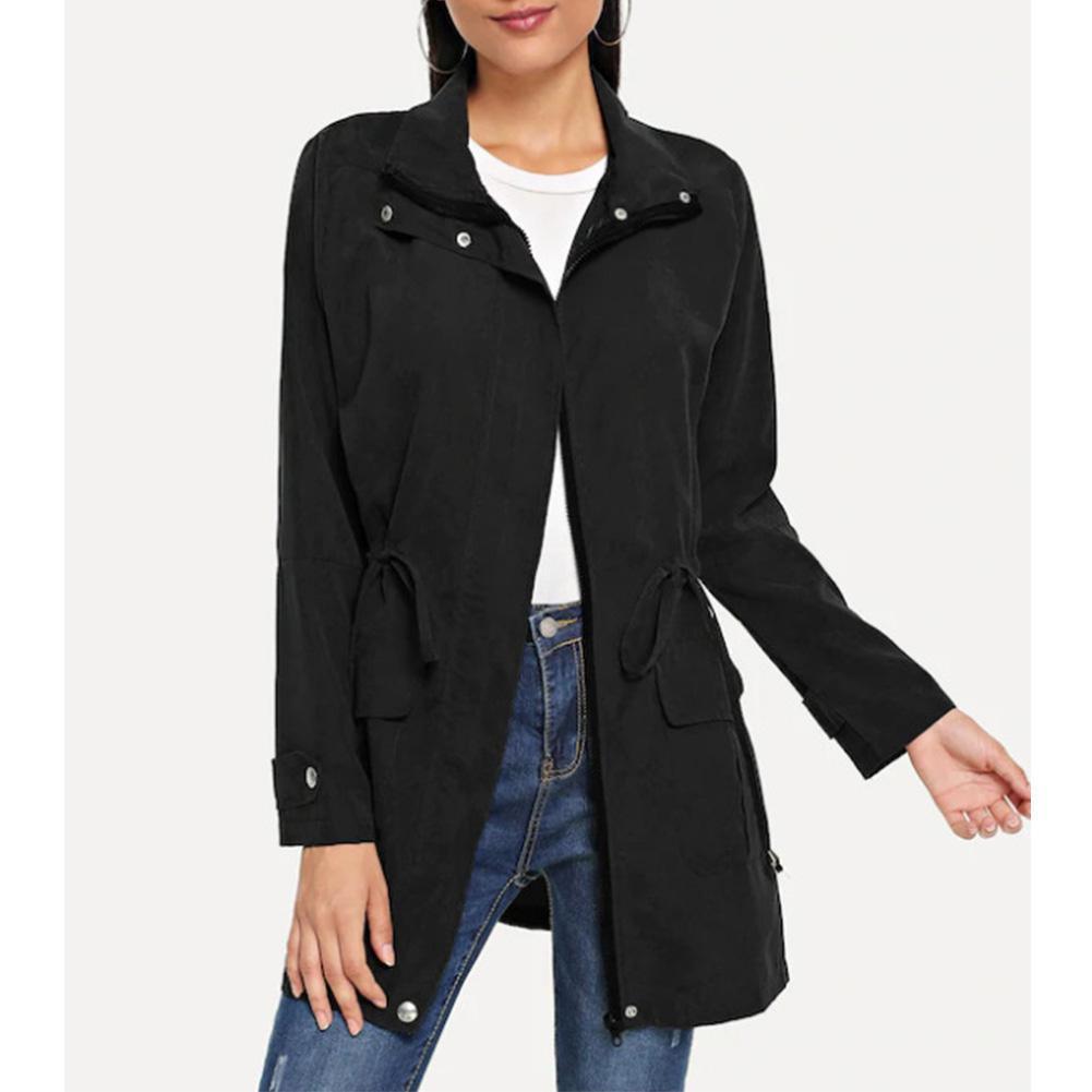 Black trench coat with notched collar, button front, tie waist, flap pockets.