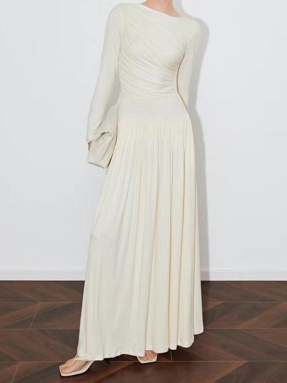 Cream long-sleeve maxi dress with ruched center bodice and pleated skirt
