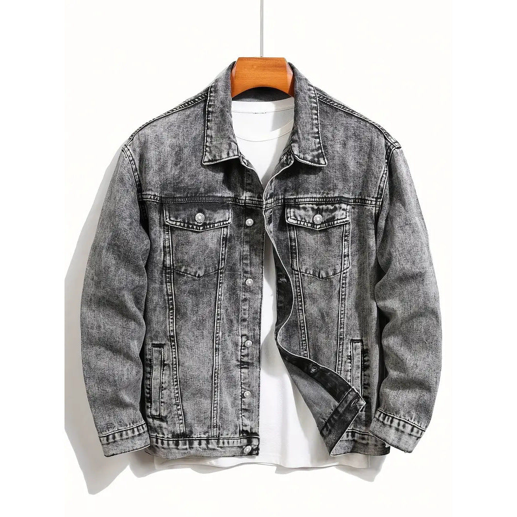 Washed gray denim jacket on hanger, button front and chest flap pockets