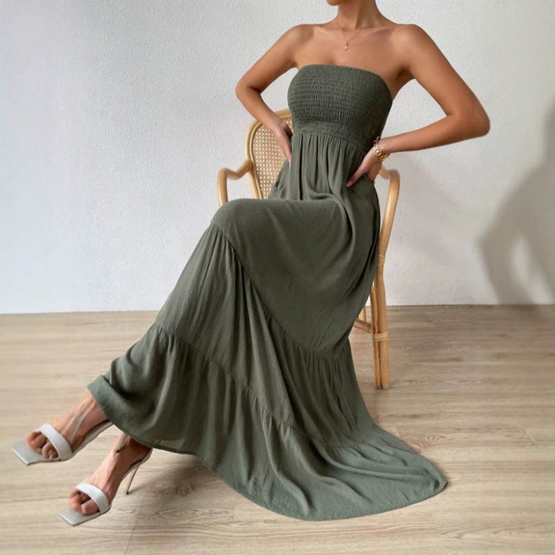 Army-green strapless long dress with smocked bodice and flowing pleated A-line skirt