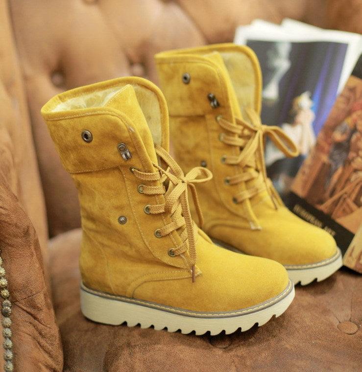 Yellow faux fur lace-up snow boots with cushioned white sole