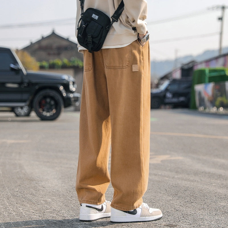 Men's loose cargo pants in tan, straight leg, cuffed hems, cargo pocket detail
