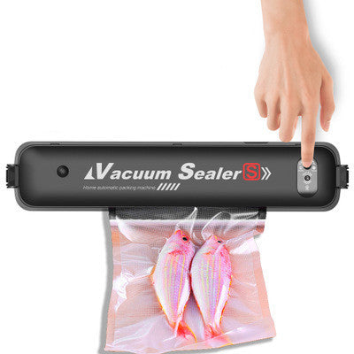 Black vacuum sealer with a hand sealing a vacuum-sealed fish bag
