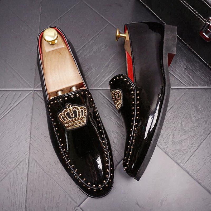 Men's black leather slip-on loafers with studded trim and gold crown badge