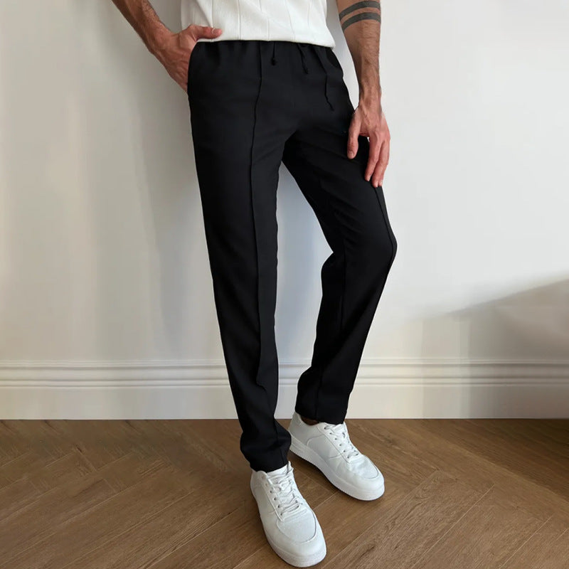 Men's pleated twill slim-fit tapered pants with elastic waist, black