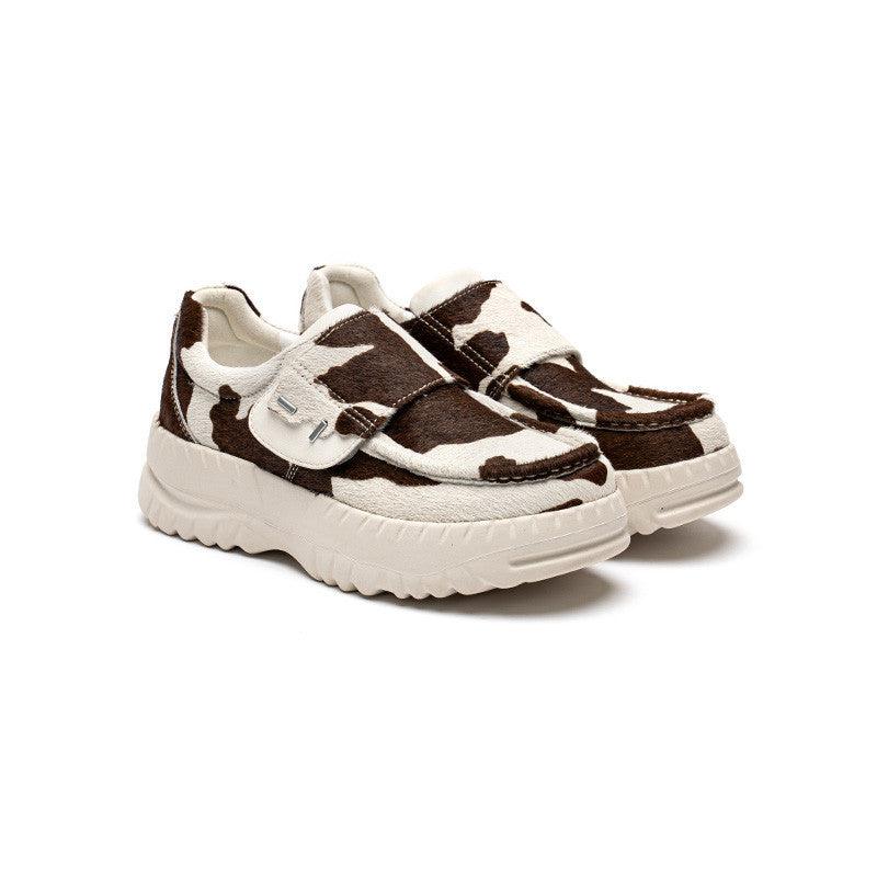 Cow-print chunky sneakers with wide Velcro strap and thick white rubber sole