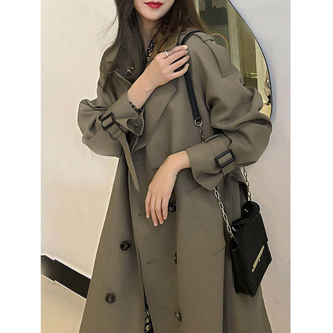 Women’s trench coat in dark olive green with double-breasted front and belt tie