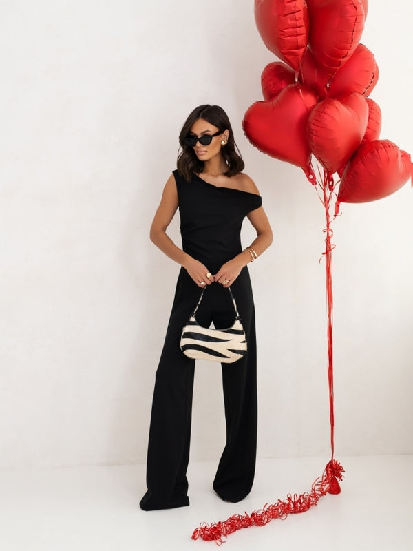 Women's black off-shoulder wide-leg jumpsuit with long straight pants silhouette.