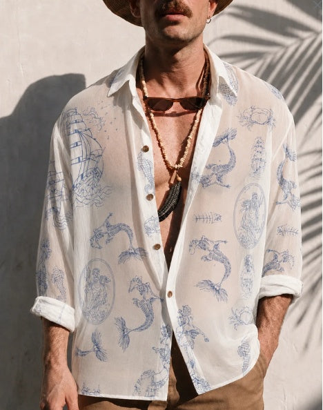 Sheer oversized button-up shirt in white with blue sea creature print, long sleeves