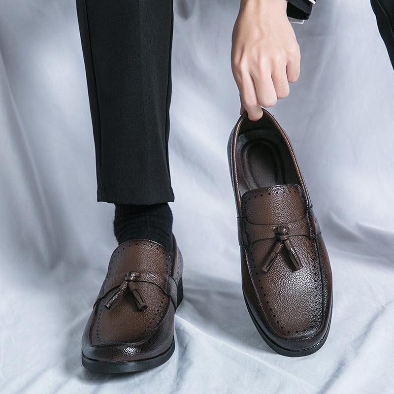 Brown round-toe leather loafer shoes with tassel detail and stitched vamp