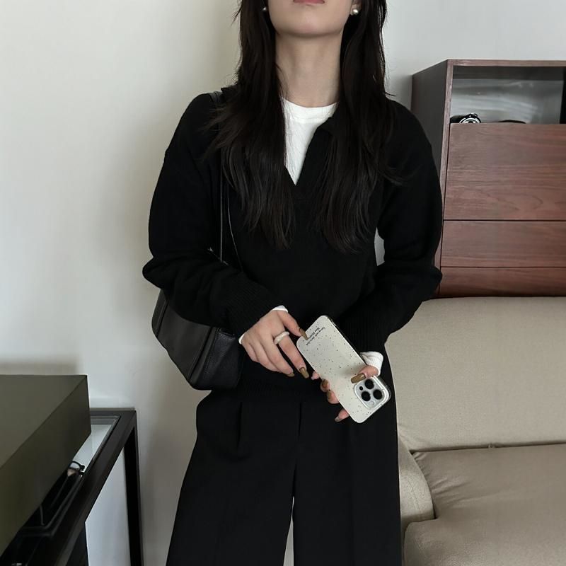 Black knitted long-sleeve polo collar top with open V neckline