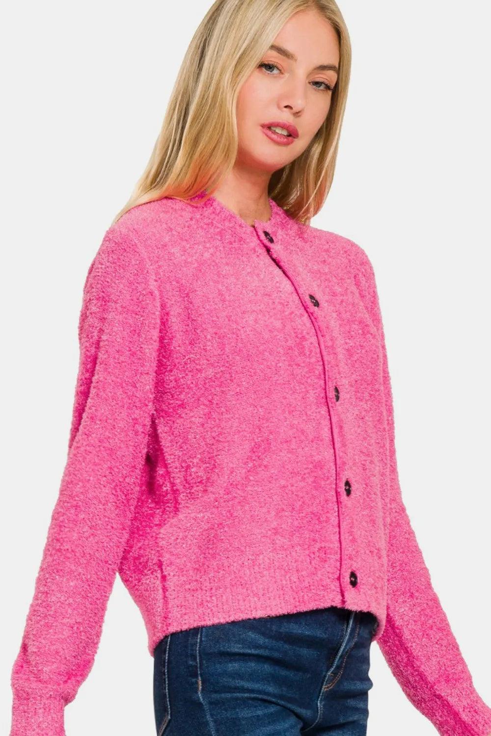 Fuchsia knit cardigan sweater with long sleeves and button-front detail at neckline