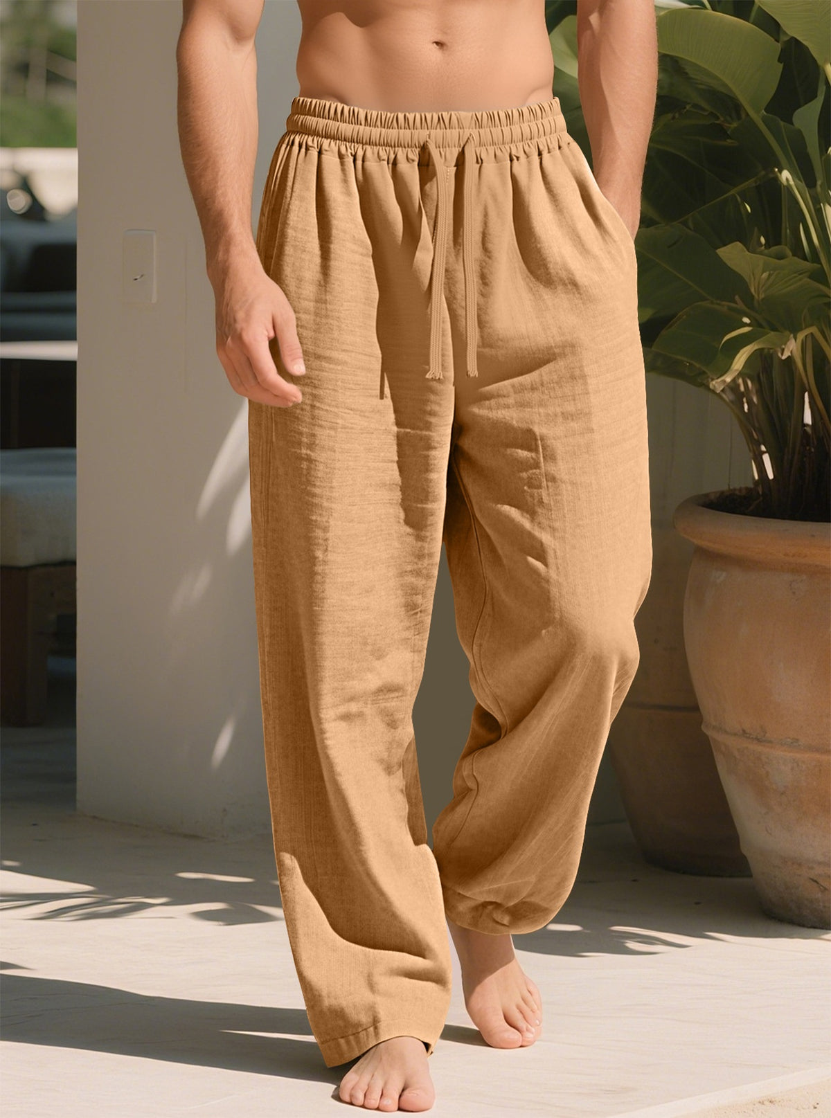 Khaki loose straight trousers with elastic waistband and ankle-length relaxed fit