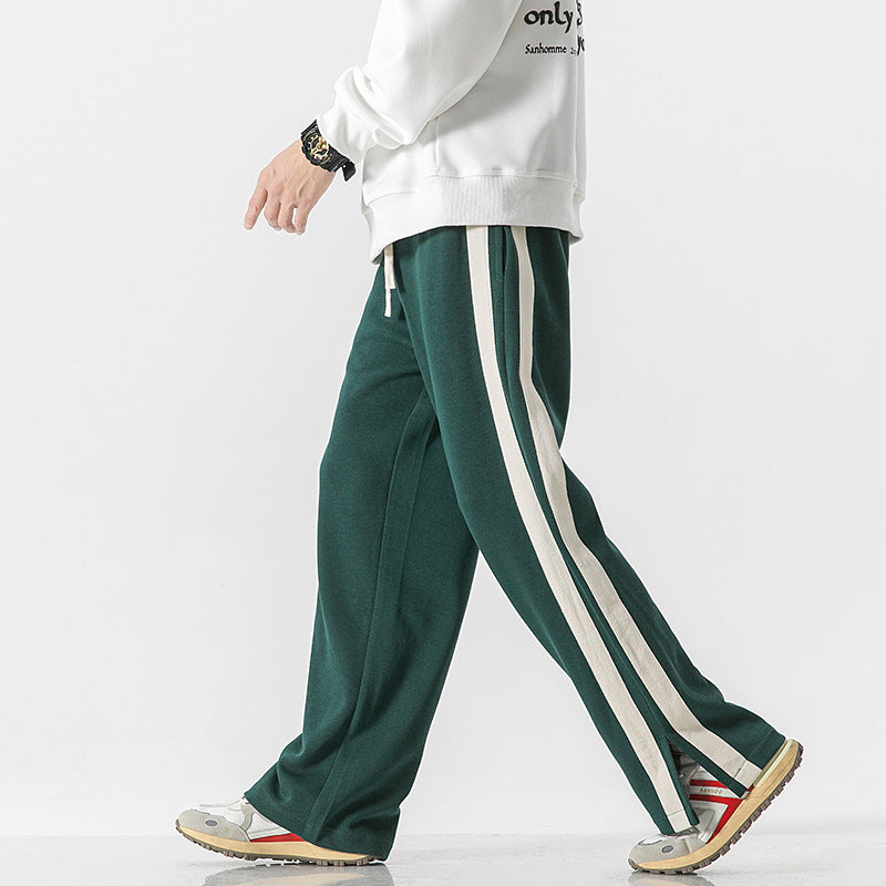 Men's dark green thin striped trousers with vertical side stripe panels