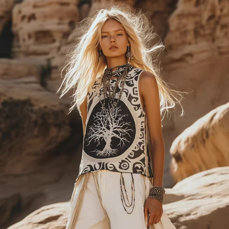 Sleeveless printed black and cream top with tree-of-life graphic and white drawstring pants