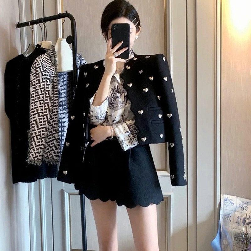Black short tweed coat with scattered heart appliques, cropped silhouette