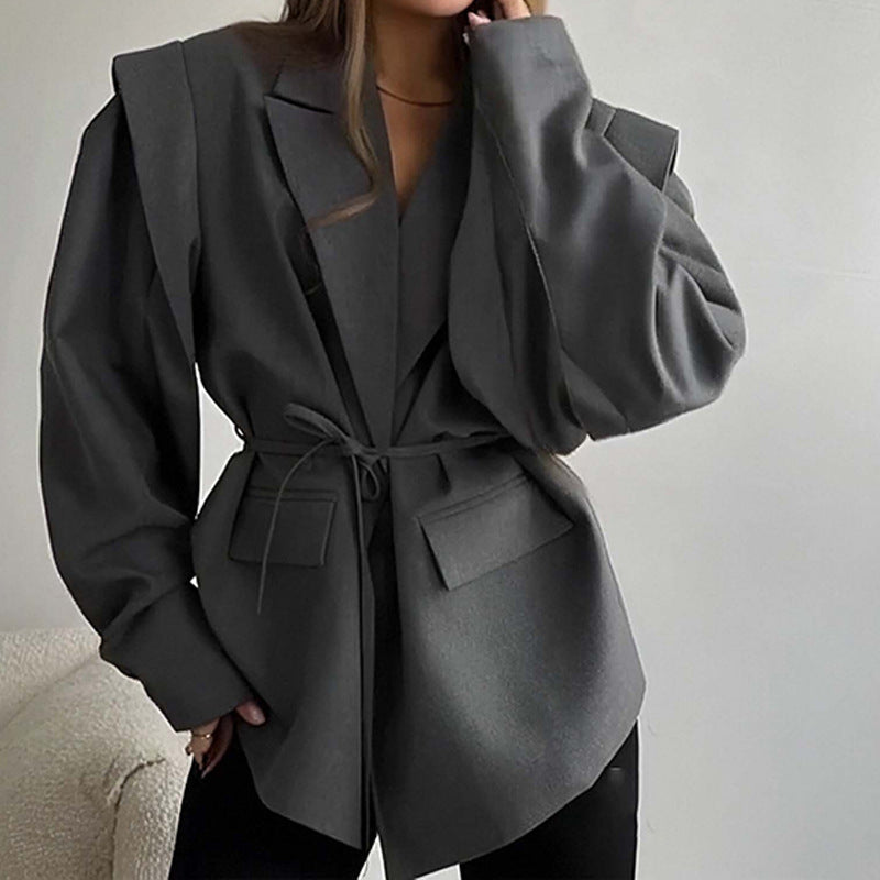Dark gray V-neck tie-waist coat with long sleeves and flap pockets, loose fit